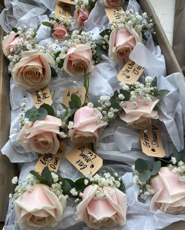 Beautiful peach rose buttonholes